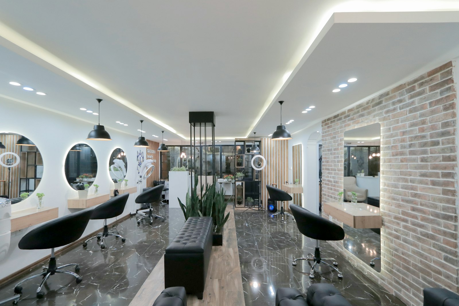 Luxury salon interior with modern design, round mirrors and ambient lighting
